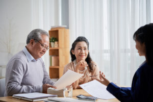 A couple speaking with an appraiser as part of the estate planning process. Learn more.